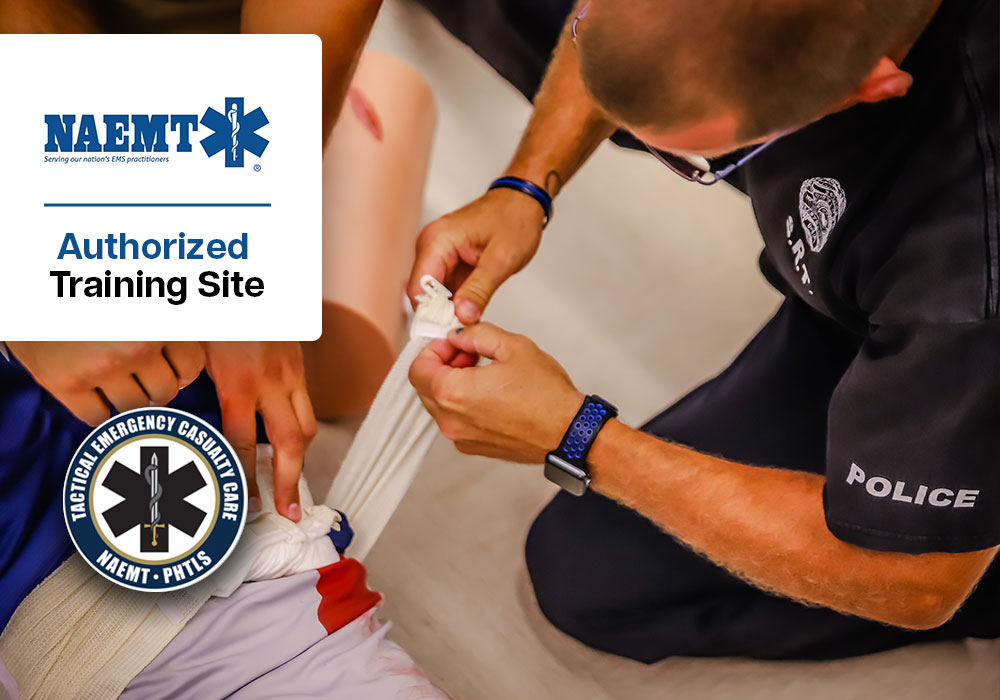 EMS professionals practicing tourniquet application in a medical training simulation