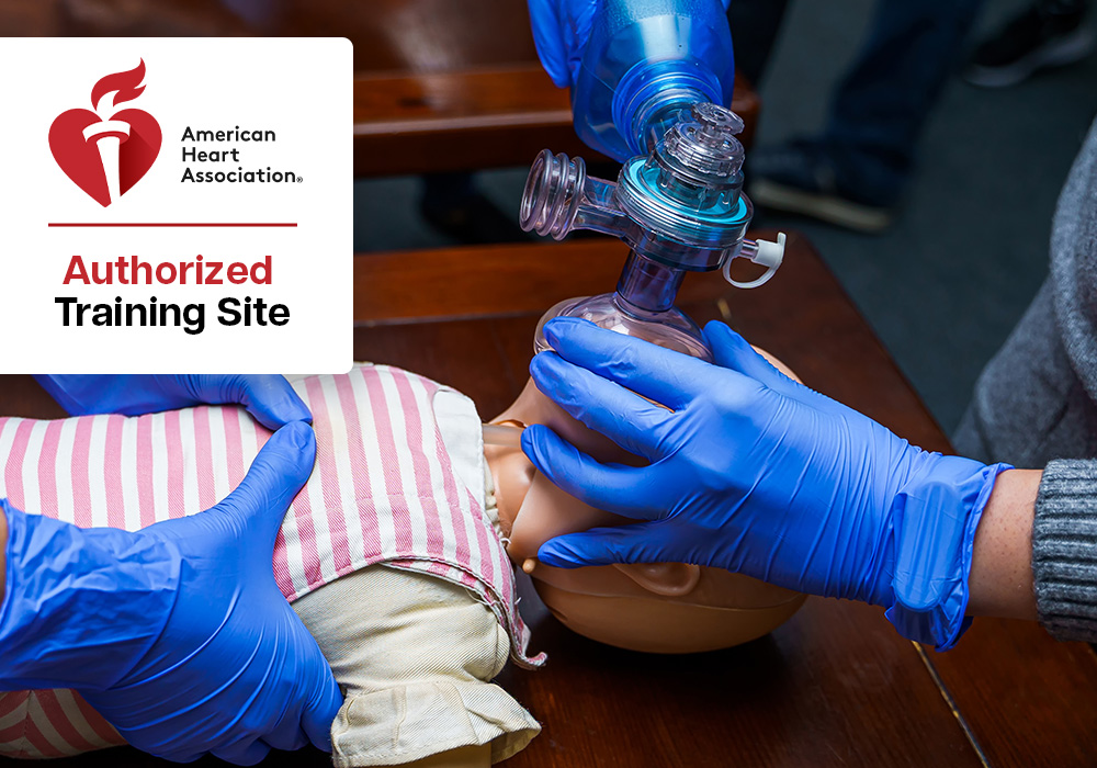 Pediatric CPR Training Simulation Paramedic student practicing rescue breathing on a child mannequin during training